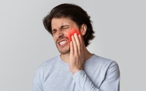 Man in tooth pain